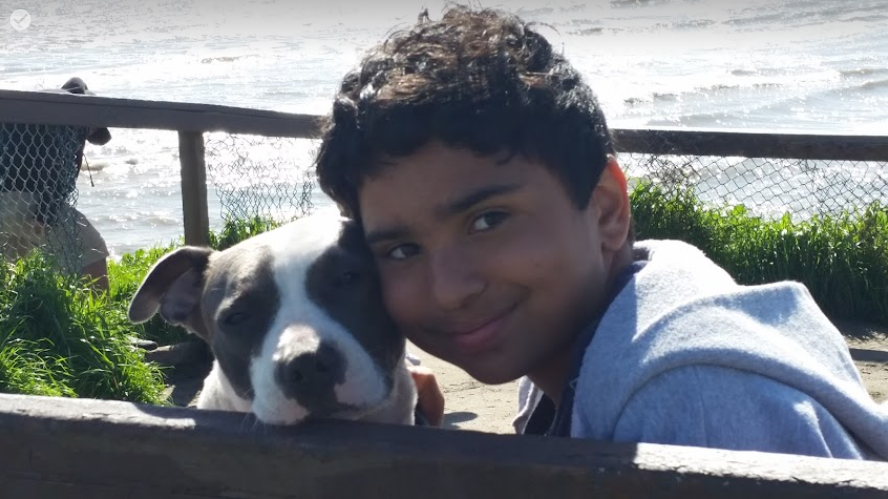 Austin Horner and dog Midjji at the coast in  Santa Cruz, California